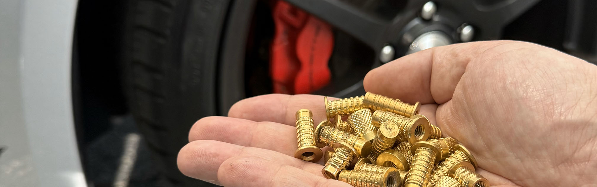 Threaded Inserts in front of sports car